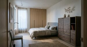 A high-end, editorial-style interior design shot of a minimalist, modern bedroom featuring a sleek b